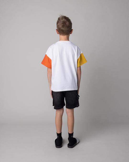 Kid wearing the Vacay Crayfish Tee in off white and mustard and orange, back view