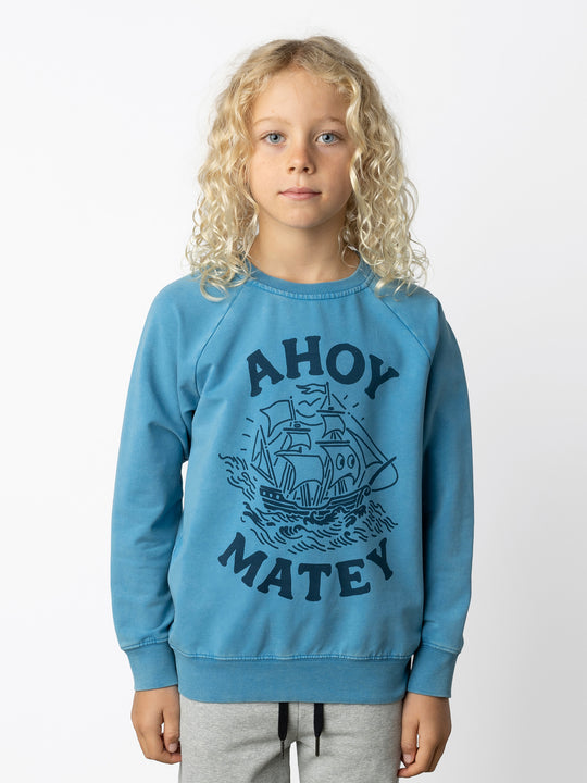 Minti kids clothing. Comfy lightweight raglan crew in super cool washed terry. 260 Gram // 95% Cotton // 5% Elastane.