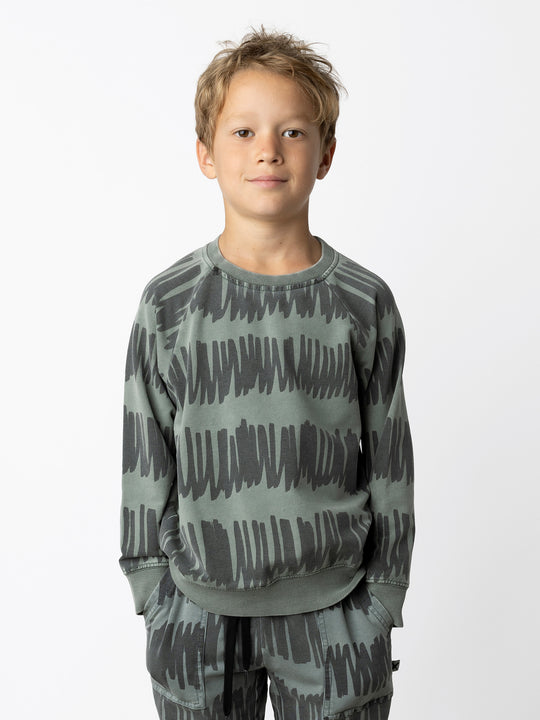 Minti kids clothing. Comfy lightweight raglan crew in super cool washed terry. 260 Gram // 95% Cotton // 5% Elastane.