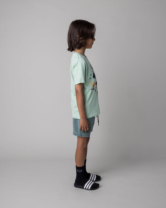 Kid wearing the Fast Panda Tee in green marle with the Blasted Track Short in forest wash, side view