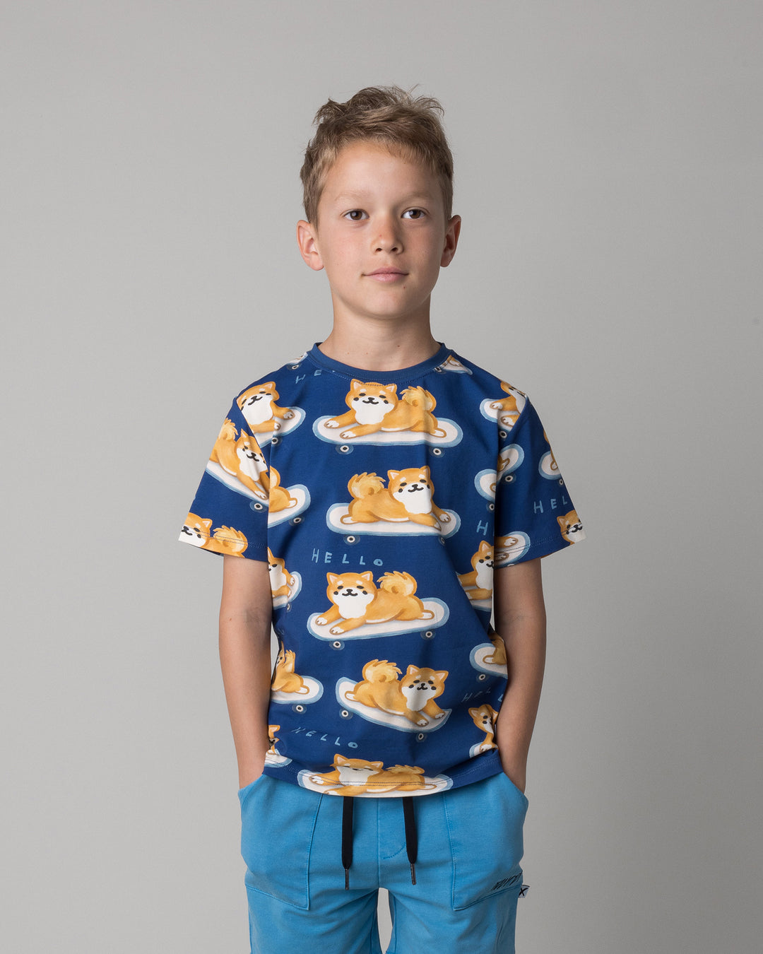 Close up of the Skate Puppy Tee in midnight on a kid, front view