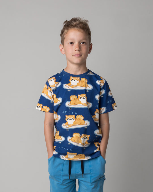 Close up of the Skate Puppy Tee in midnight on a kid, front view