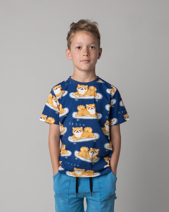 Close up of the Skate Puppy Tee in midnight on a kid, front view