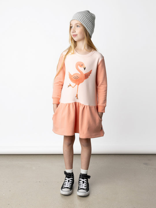 Minti kids clothing. Super cool sweatshirting weight dress with dropped skirt hem, pockets and ruching at the skirt seam. 330 Gram // Brushed Inside // 95% Cotton // 5% Elastane.