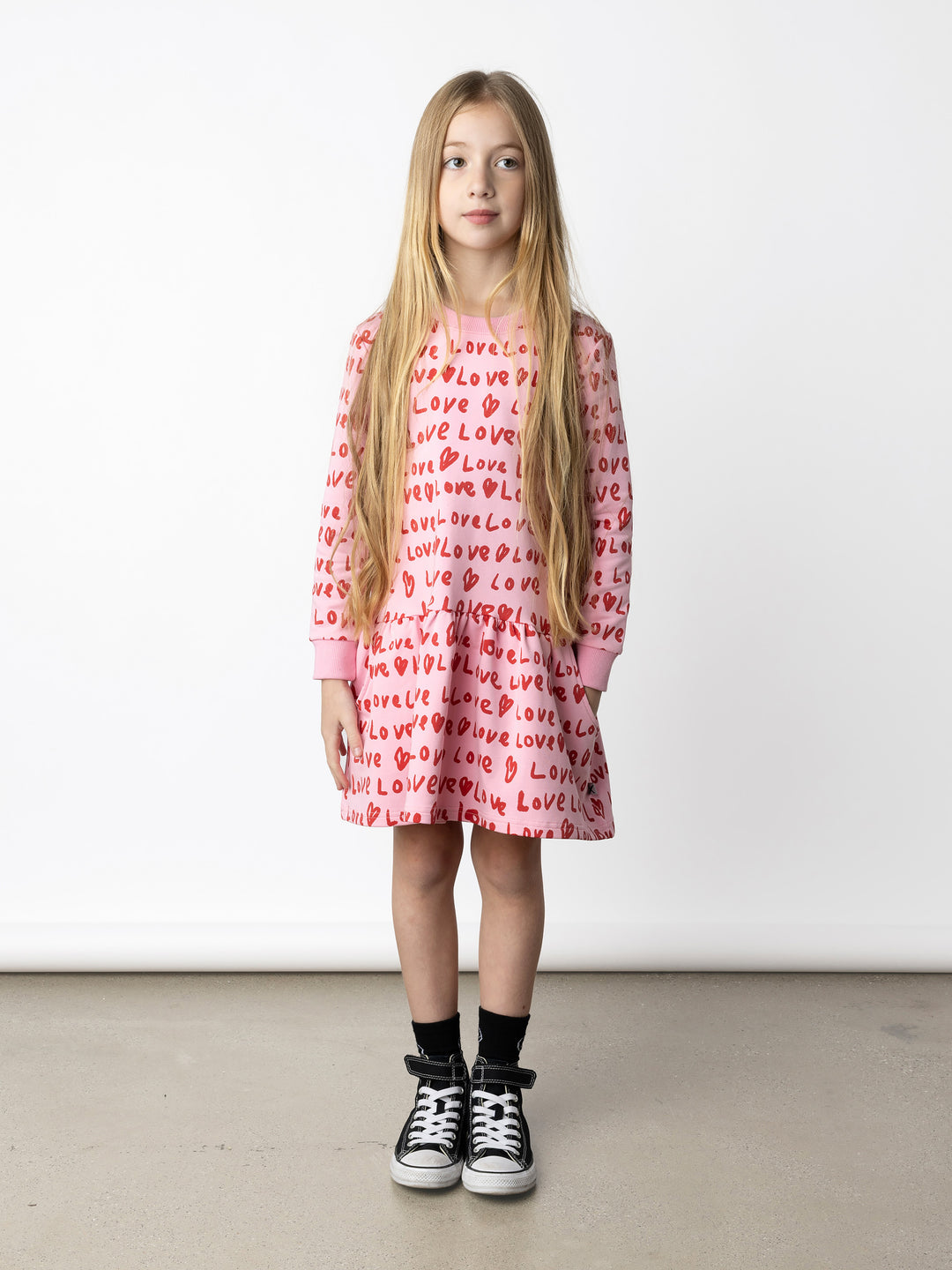Minti kids clothing. Super cool sweatshirting weight dress with dropped skirt hem, pockets and ruching at the skirt seam. 320 Gram // 95% Cotton // 5% Elastane.