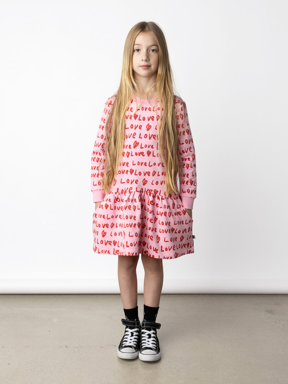 Minti kids clothing. Super cool sweatshirting weight dress with dropped skirt hem, pockets and ruching at the skirt seam. 320 Gram // 95% Cotton // 5% Elastane.