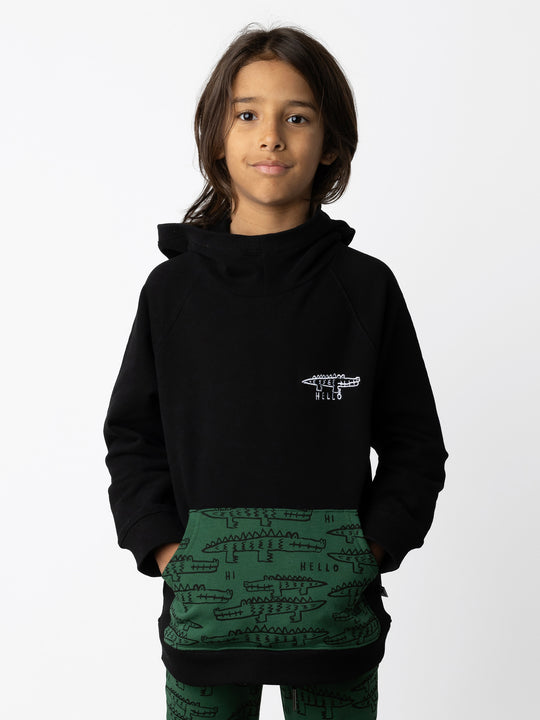 Minti kids clothing. Very comfy hoodie with raglan sleeves and contrast front kangaroo pocket. Small Hello Croc embroidery on the front. 330 Gram // Brushed Inside // 95% Cotton // 5% Elastane.
