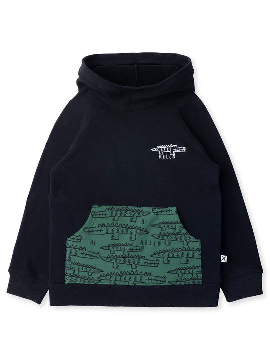 Minti kids clothing. Very comfy hoodie with raglan sleeves and contrast front kangaroo pocket. Small Hello Croc embroidery on the front. 330 Gram // Brushed Inside // 95% Cotton // 5% Elastane.