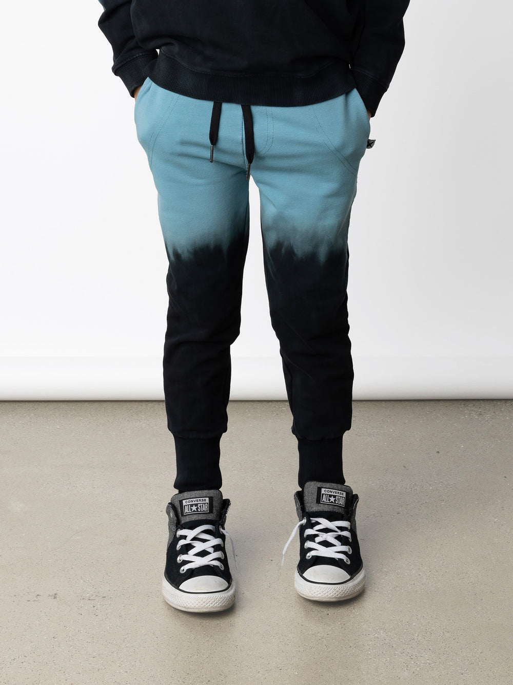 Minti kids clothing. Straight leg trackies with stitched detail pockets, elasticated waistband, shoelace ties and back pocket. Small Minti embroidery on the back pocket. 320 Gram // 95% Cotton // 5% Elastane.