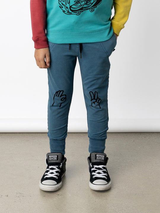 Minti kids clothing. Straight leg trackies with stitched detail pockets, elasticated waistband, shoelace ties and back pocket. 260 Gram // 95% Cotton // 5% Elastane.