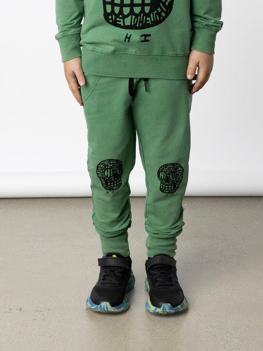 Minti kids clothing. Straight leg trackies with stitched detail pockets, elasticated waistband, shoelace ties and back pocket. 260 Gram // 95% Cotton // 5% Elastane.