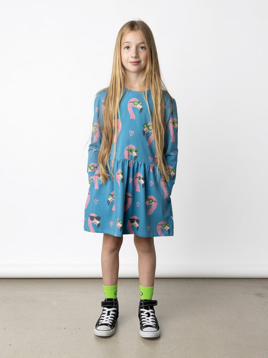 Minti kids clothing. Tshirting weight dress with self cuffs, hidden side pockets and waist seam with ruching detail. 190 Gram // 95% Cotton // 5% Elastane.