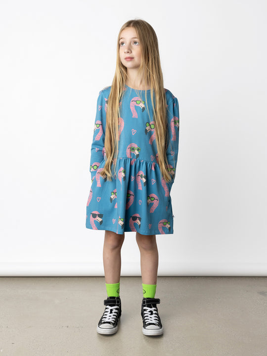 Minti kids clothing. Tshirting weight dress with self cuffs, hidden side pockets and waist seam with ruching detail. 190 Gram // 95% Cotton // 5% Elastane.