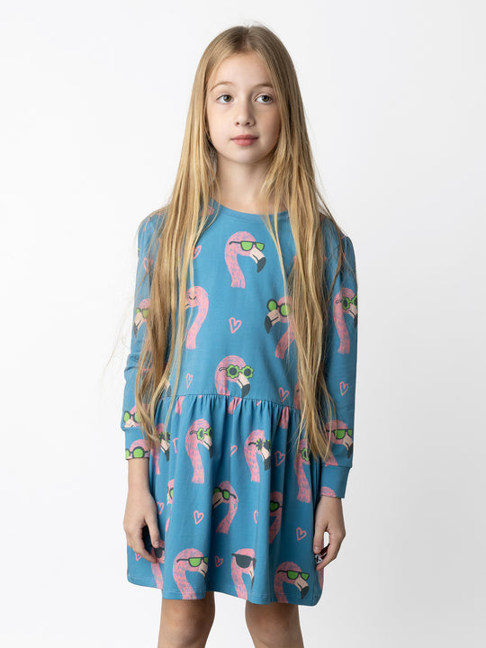 Minti kids clothing. Tshirting weight dress with self cuffs, hidden side pockets and waist seam with ruching detail. 190 Gram // 95% Cotton // 5% Elastane.