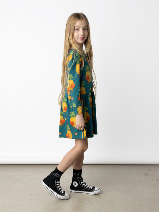 Minti kids clothing. Tshirting weight dress with self cuffs, hidden side pockets and waist seam with ruching detail. 190 Gram // 95% Cotton // 5% Elastane.