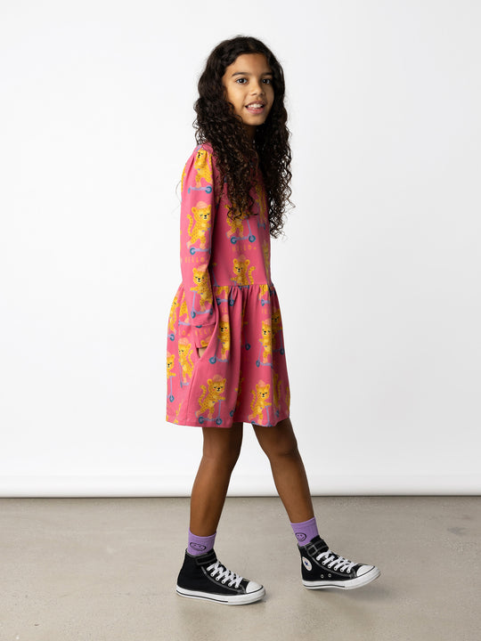 Minti kids clothing. Tshirting weight dress with self cuffs, hidden side pockets and waist seam with ruching detail. 190 Gram // 95% Cotton // 5% Elastane.