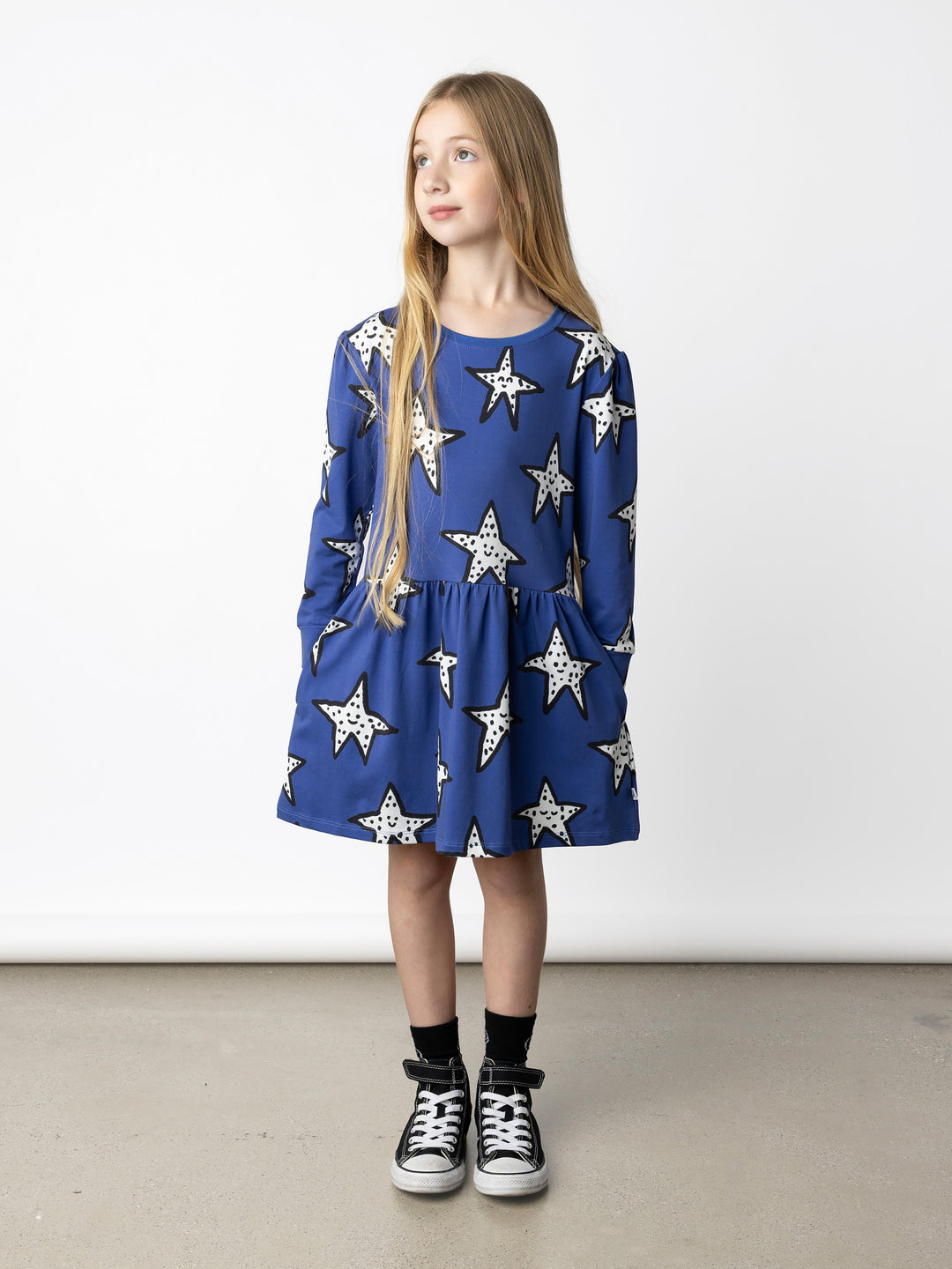 Minti kids clothing. Tshirting weight dress with self cuffs, hidden side pockets and waist seam with ruching detail. 190 Gram // 95% Cotton // 5% Elastane.