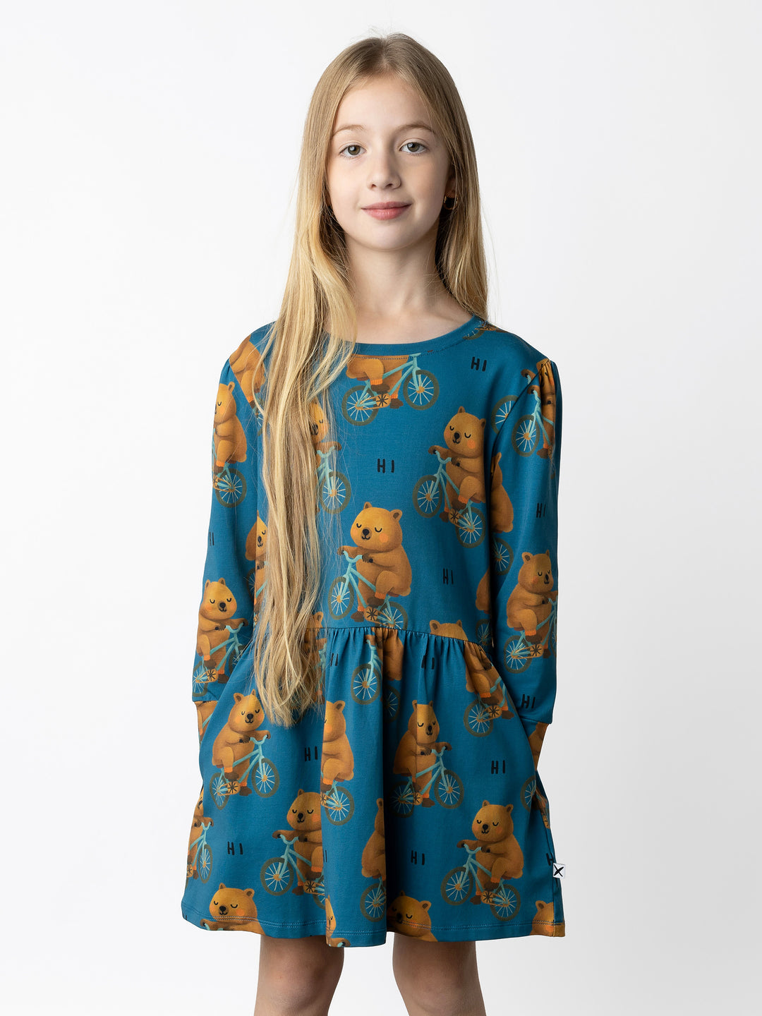 Minti kids clothing. Tshirting weight dress with self cuffs, hidden side pockets and waist seam with ruching detail. 190 Gram // 95% Cotton // 5% Elastane.