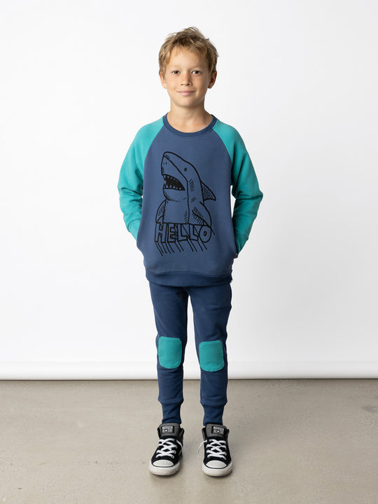 Minti kids clothing. Super cool and comfy crew with hidden side pockets. Perfect for keeping hands warm! 330 Gram // Brushed Inside // 95% Cotton // 5% Elastane.