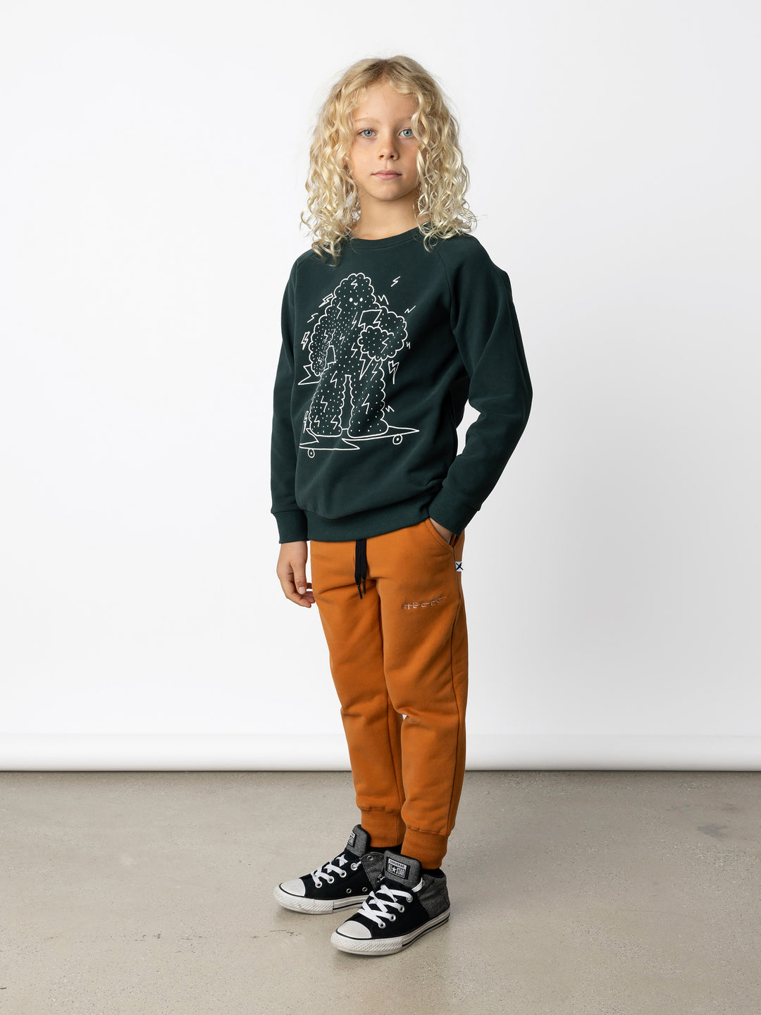 Minti kids clothing. Super cool and comfy crew with hidden side pockets. Perfect for keeping hands warm! 330 Gram // Brushed Inside // 95% Cotton // 5% Elastane.