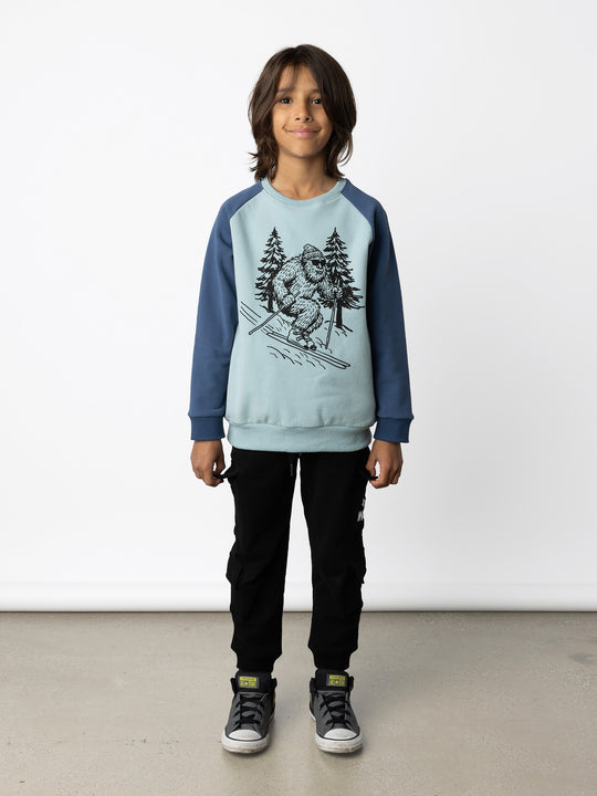 Minti kids clothing. Super cool and comfy crew with hidden side pockets. Perfect for keeping hands warm! 330 Gram // Brushed Inside // 95% Cotton // 5% Elastane.