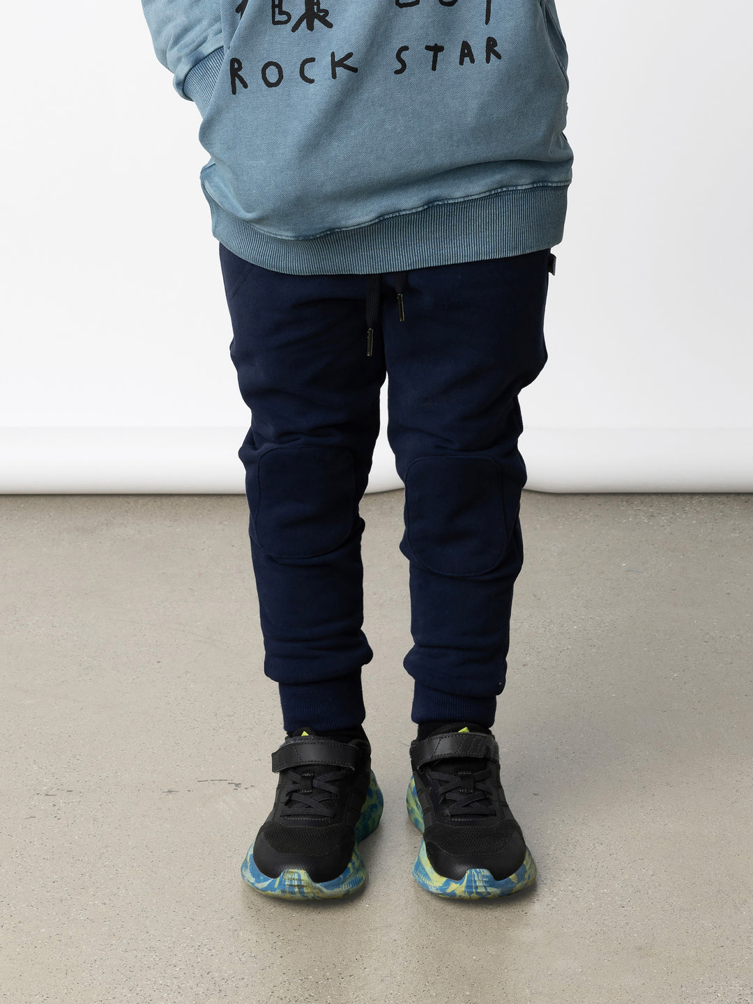 Minti kids clothing. Luxe trackies with sewn on patch knees, front pockets and shoelace ties. Small Minti embroidery on the back. 330 Gram // Brushed Inside // 95% Cotton // 5% Elastane.
