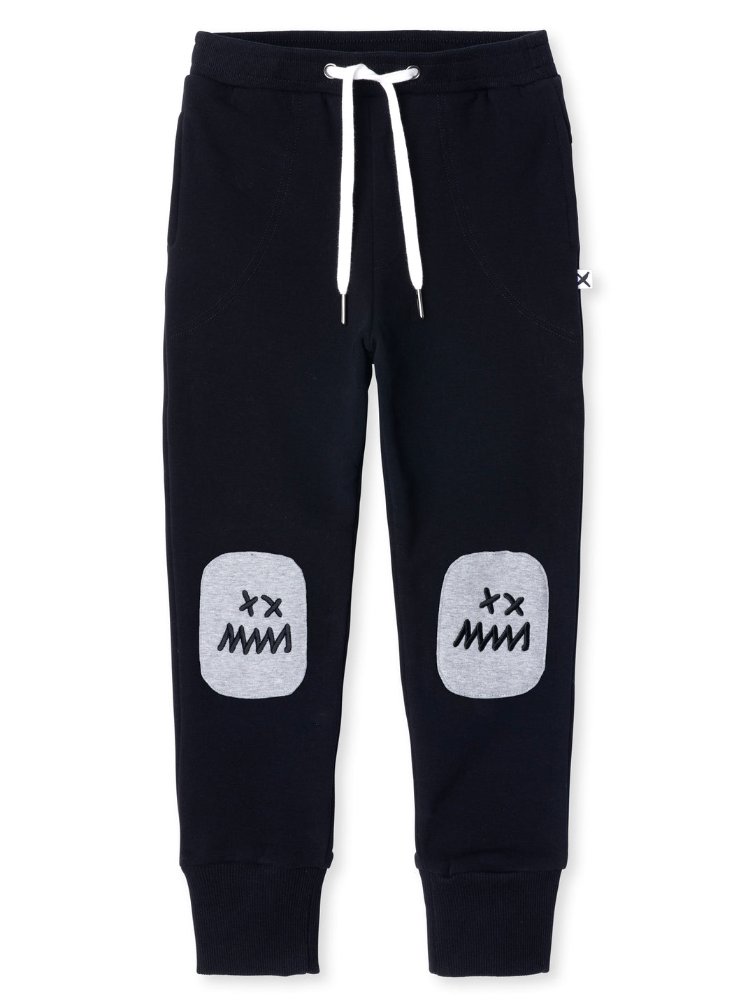 Minti kids clothing. Luxe trackies with sewn on patch knees, front pockets and shoelace ties. Super cool embroideries on the knee patches. 330 Gram // Brushed Inside // 95% Cotton // 5% Elastane.