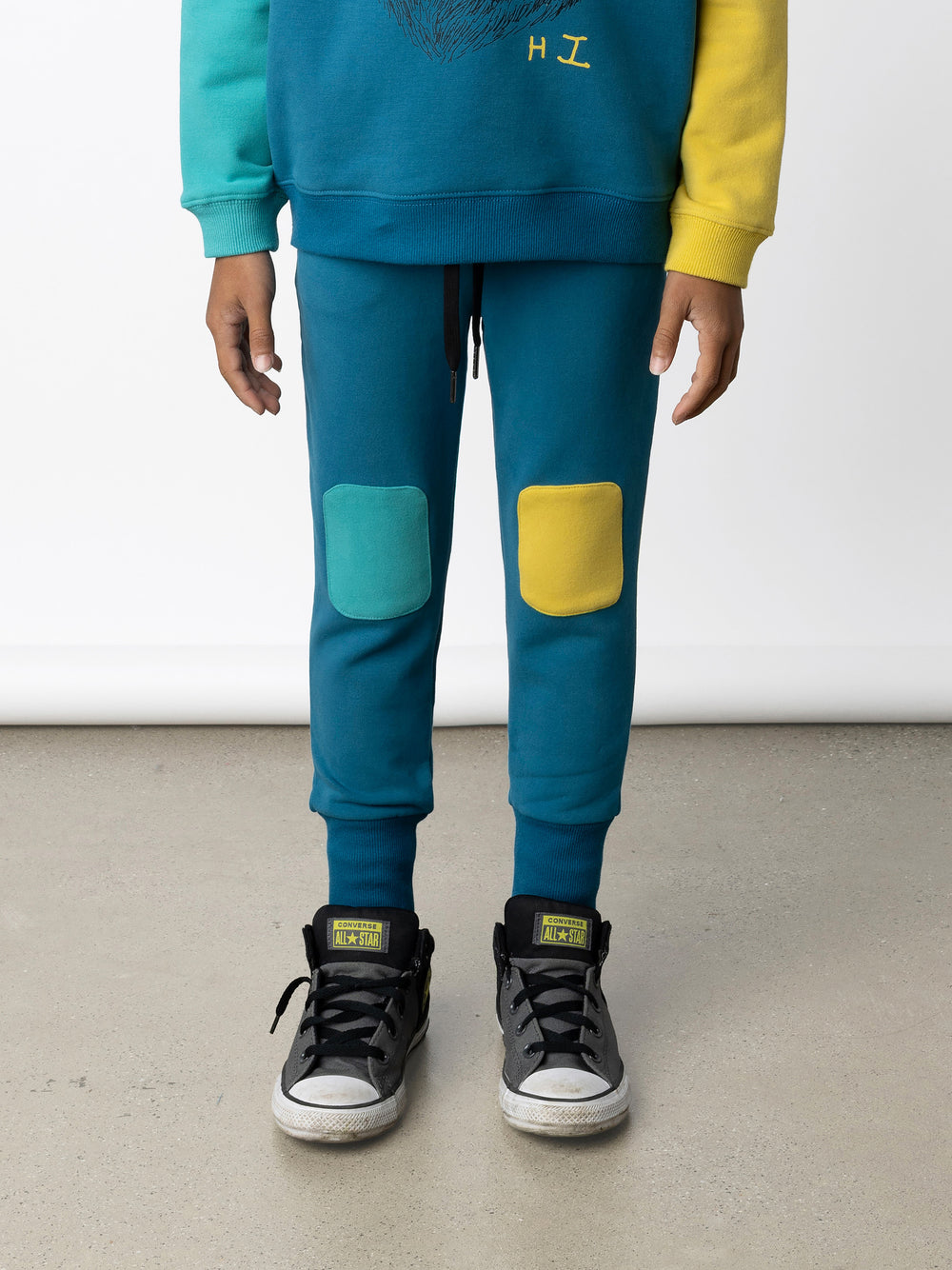 Minti kids clothing. Super luxe trackies with sewn on patch knees, front pockets and shoelace ties. Small Minti embroidery on the back. 260 Gram // 95% Cotton // 5% Elastane.