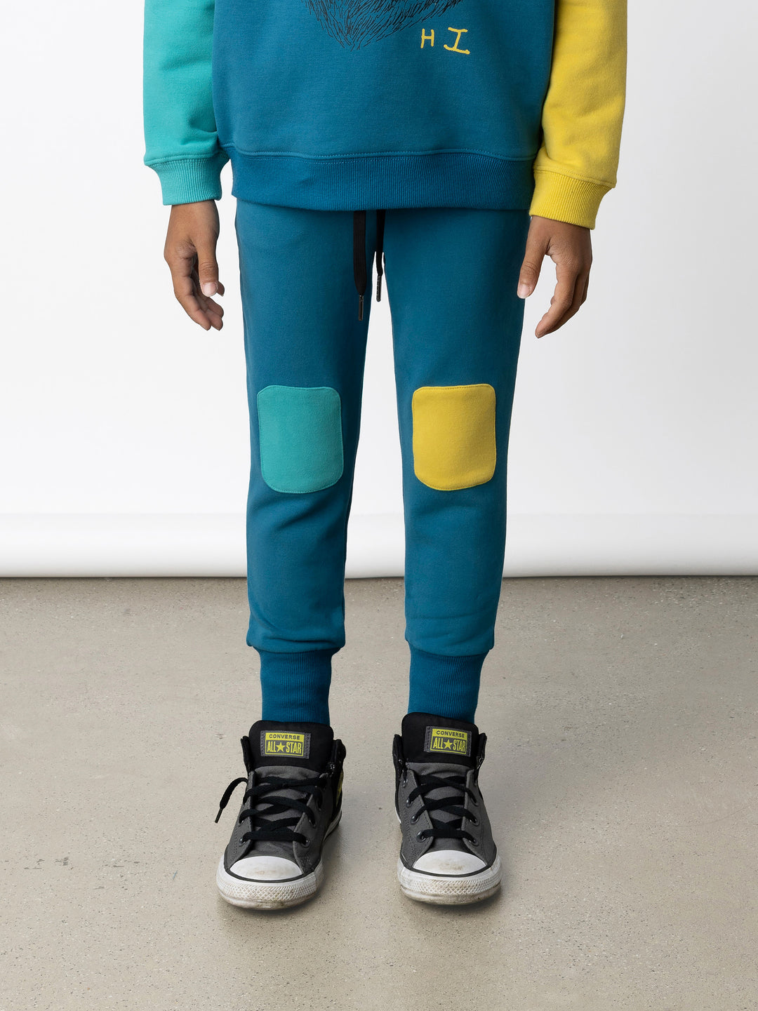 Minti kids clothing. Super luxe trackies with sewn on patch knees, front pockets and shoelace ties. Small Minti embroidery on the back. 260 Gram // 95% Cotton // 5% Elastane.