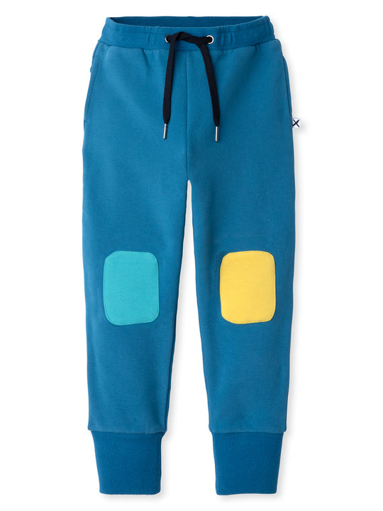 Minti kids clothing. Super luxe trackies with sewn on patch knees, front pockets and shoelace ties. Small Minti embroidery on the back. 260 Gram // 95% Cotton // 5% Elastane.
