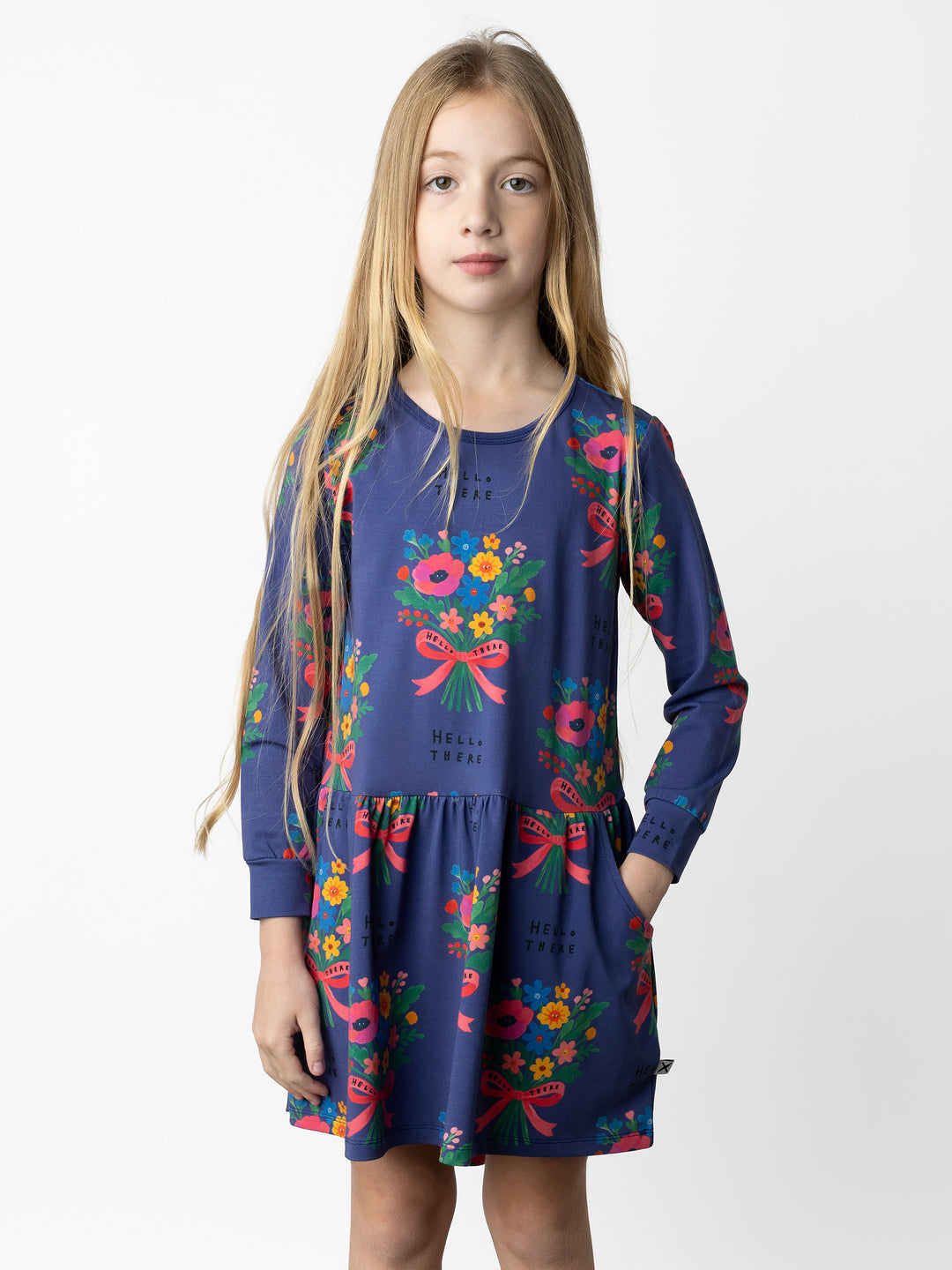 Minti kids clothing. Comfy tshirting weight dress with ruched skirt seam, front pockets and scooped back hem. 190 Gram // 95% Cotton // 5% Elastane.