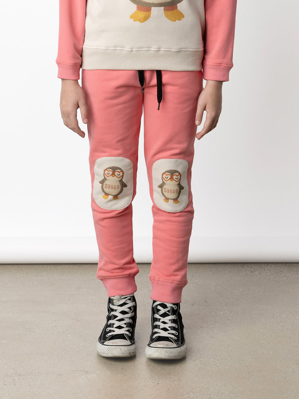 Minti kids clothing. Slim leg trackies with front pockets, shoelace cord and 2x2 rib waistband and cuffs. We recommend to go up a size for this style. 330 Gram // Brushed Inside // 95% Cotton // 5% Elastane.