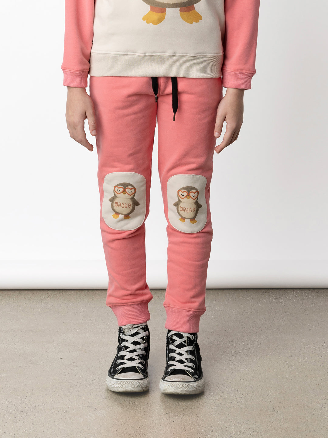 Minti kids clothing. Slim leg trackies with front pockets, shoelace cord and 2x2 rib waistband and cuffs. We recommend to go up a size for this style. 330 Gram // Brushed Inside // 95% Cotton // 5% Elastane.