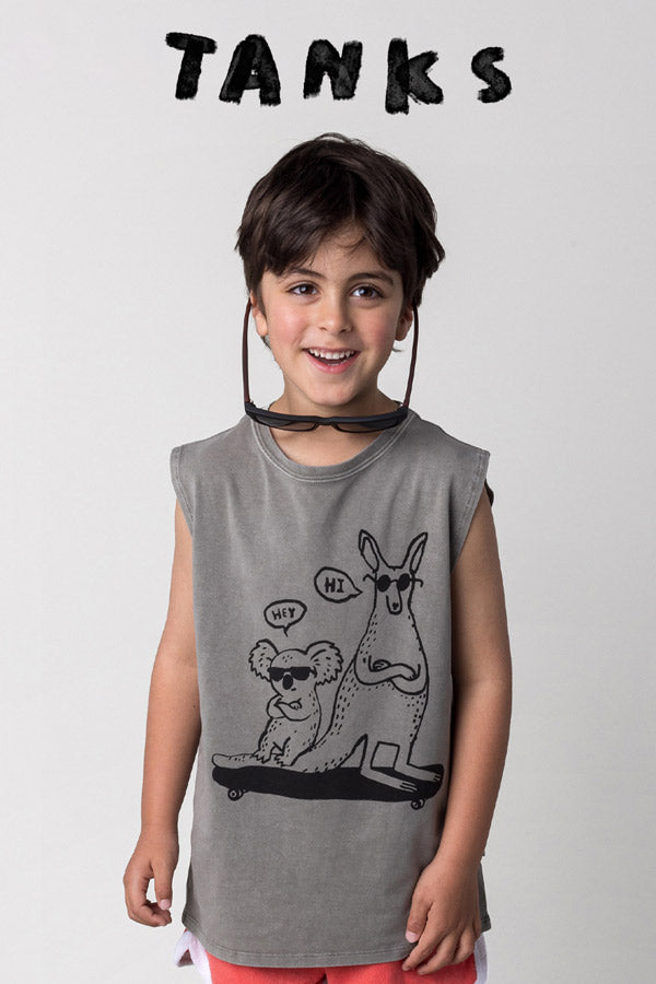 Shop tanks at Minti, kid wearing the Chill Mates Sleeveless Tee in grey wash